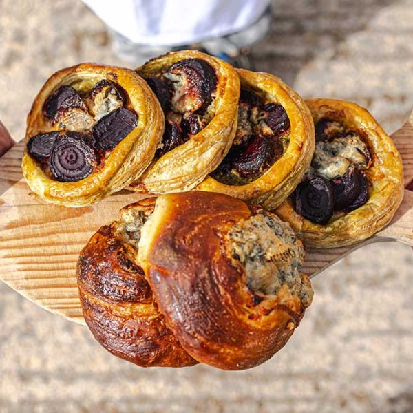 A selection of pastries on wooden chopping board